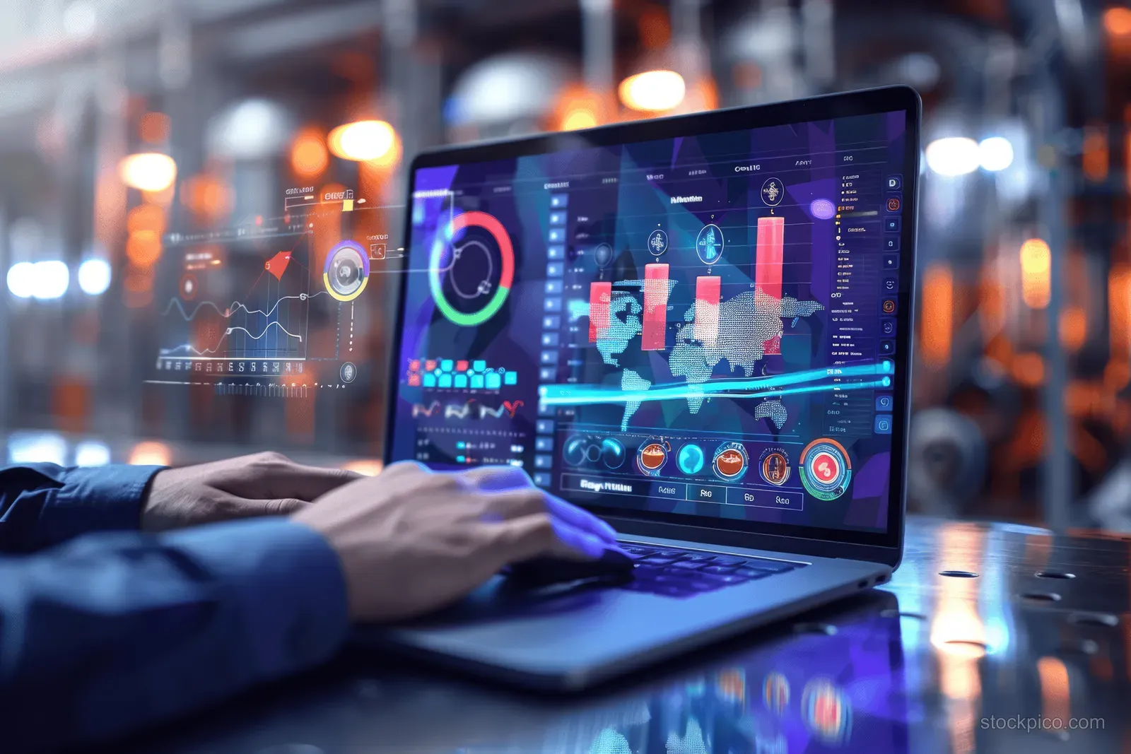 Engineer’s hands operate a laptop showing HVAC monitoring graphs and colorful icons inside an industrial control room.