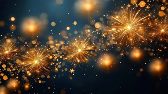 Golden fireworks burst in a dark blue night sky, scattering glowing sparks and light particles.