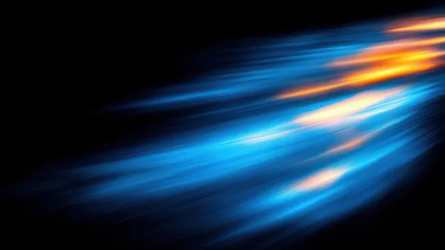 Blue and orange streaking lights blur across a black background, showing rapid speed and energy.