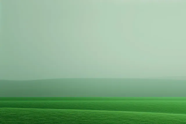 Rolling green meadow stretches to the horizon under a calm, muted sky.