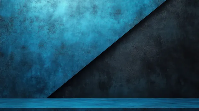 Textured blue and black walls meet along a diagonal line in an empty interior with a matching dark floor.