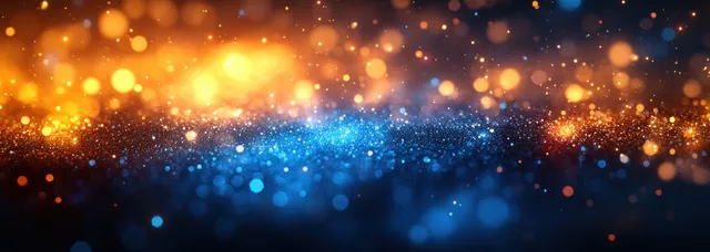 Defocused blue and yellow holiday lights with warm golden bokeh particles spread across a winter abstract background.