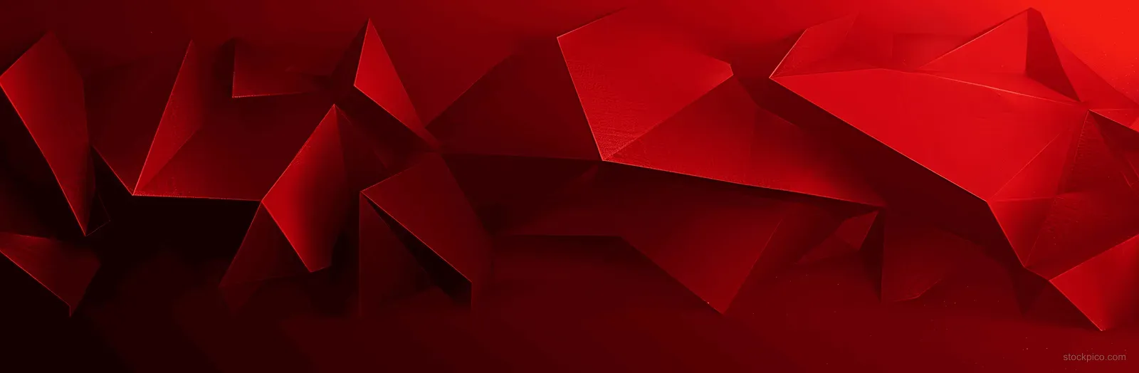 Red and black geometric abstract background with sharp triangular folds and deep angular shadows.