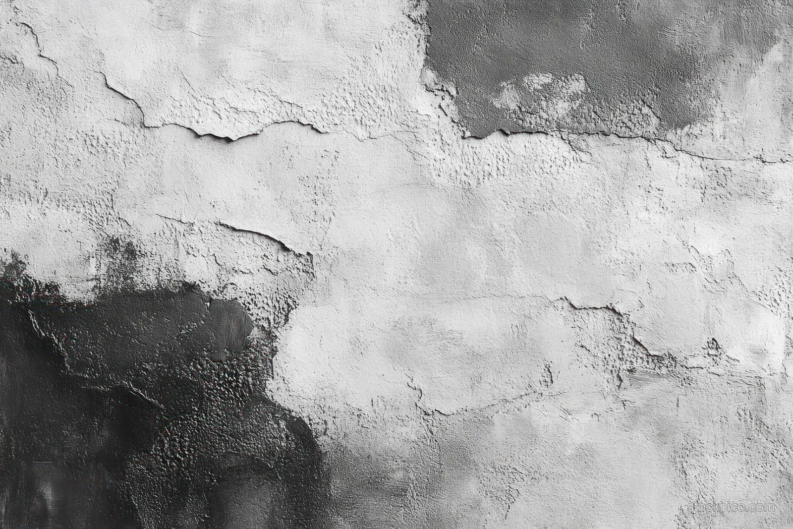 Close-up of a weathered concrete wall with peeling paint and cracked textured surface in black and white tones.