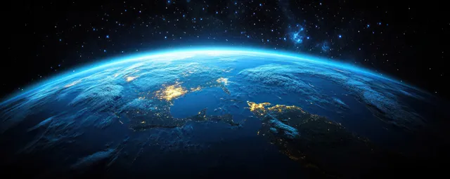 Earth from space showing New Zealand and Australia with glowing blue oceans and faint night lights.