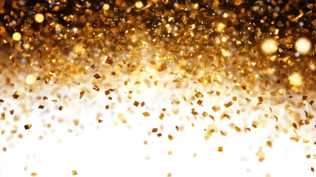 Golden glitter and confetti showering down over a bright white background