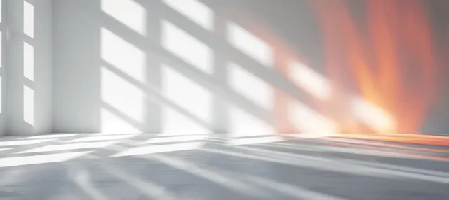 Sunlit window stripes over smooth light-gray floor, minimalist interior with soft shadow gradients