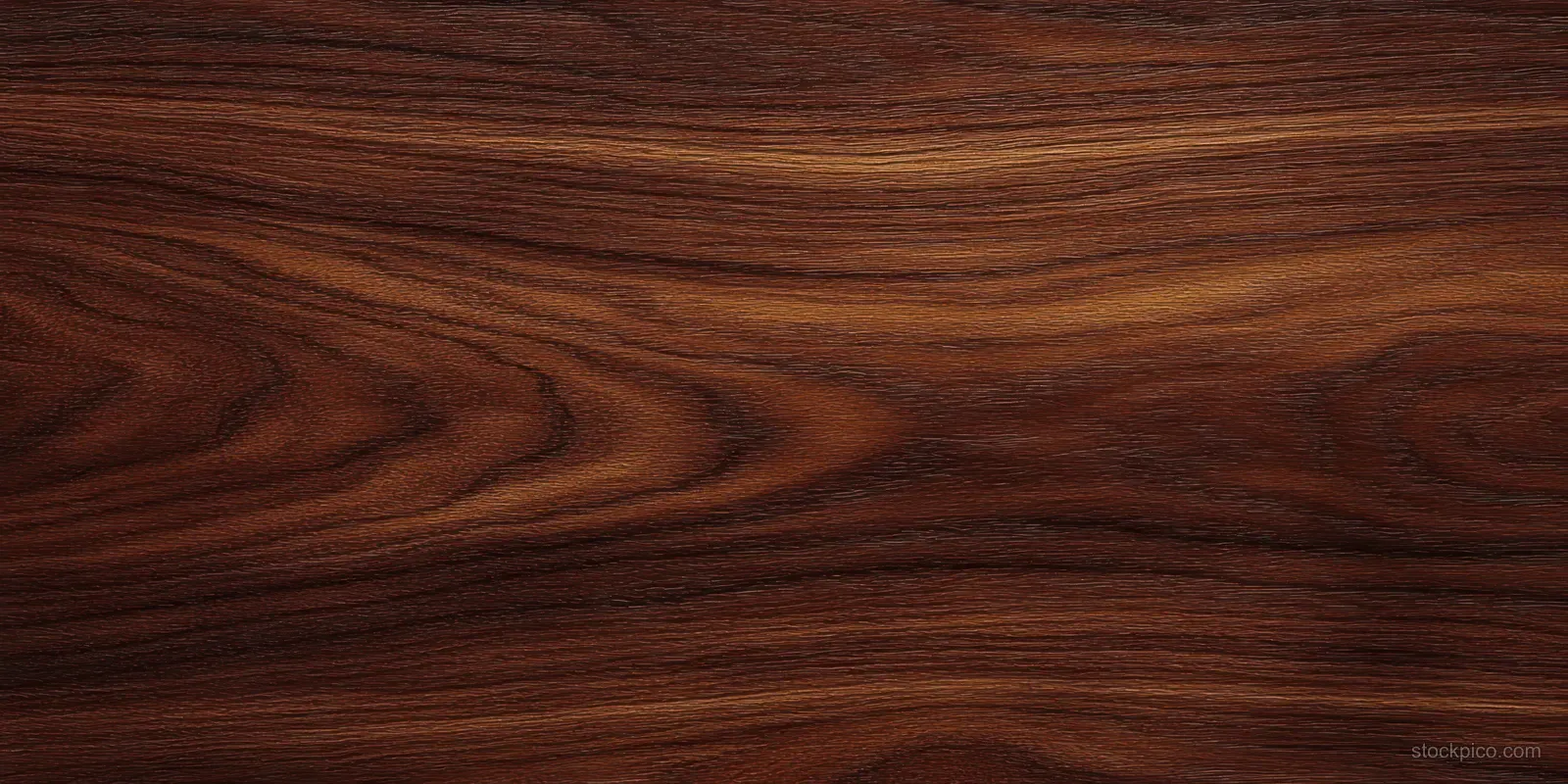 Close-up of a dark brown wood surface with flowing grain patterns.