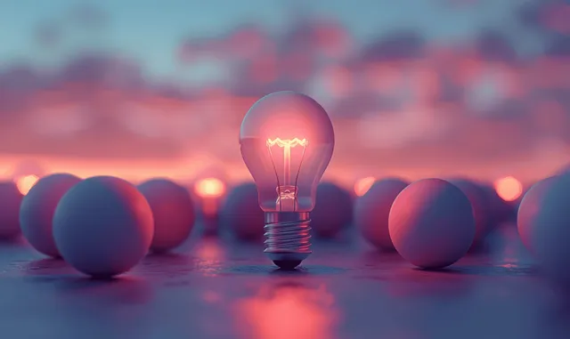 Glowing light bulb stands out among dark bulbs on pastel green background