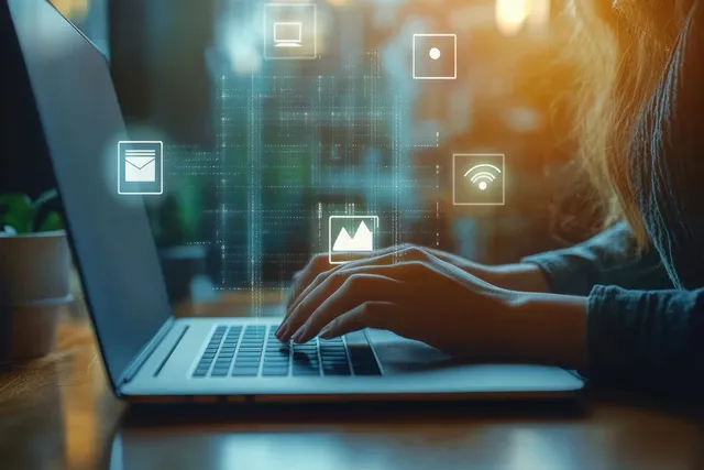 Auditor typing on laptop while digital checkmarks and validation icons float overhead
