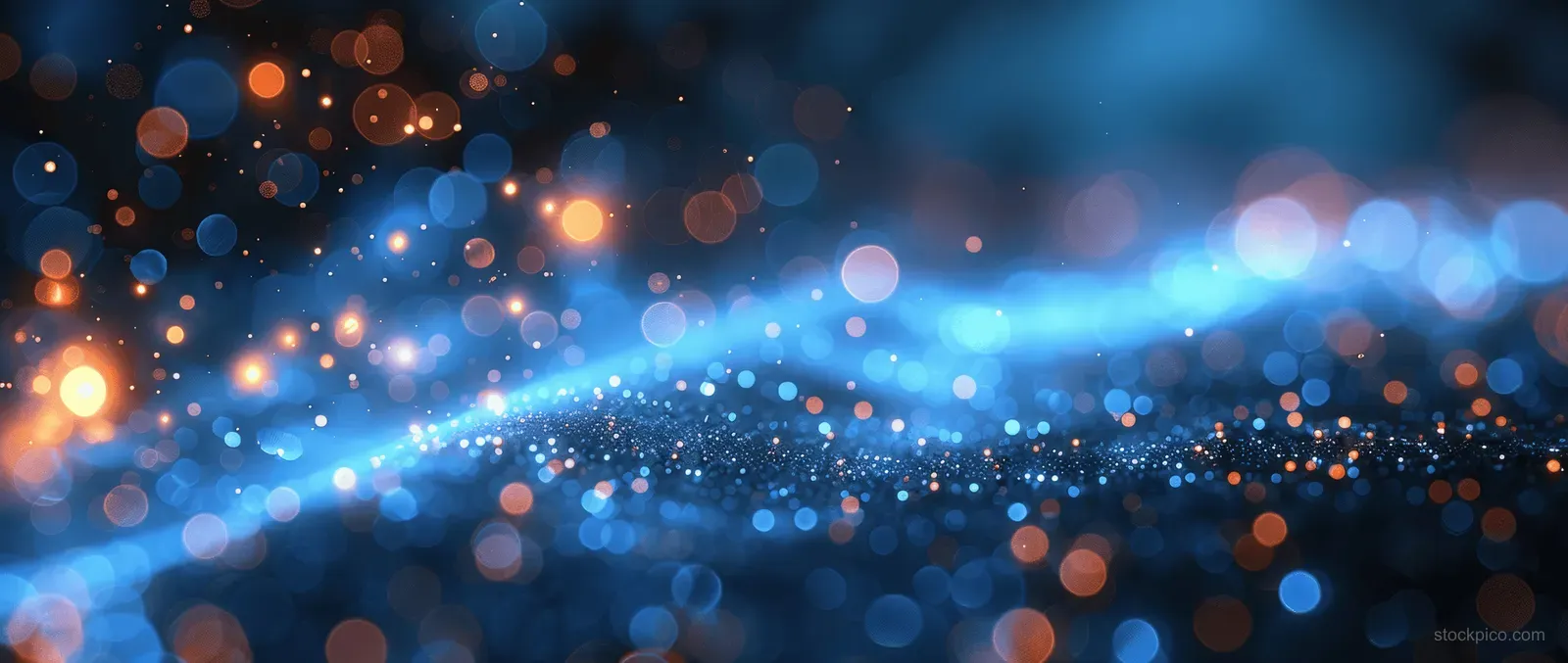 Dark blue background with black vignette and centered teal spotlight glow surrounded by blurred bokeh lights.