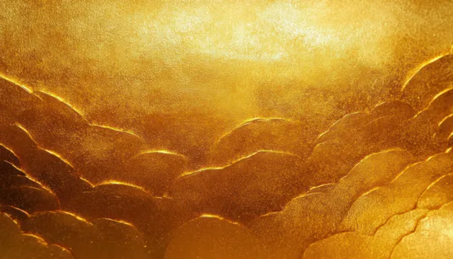 Warm gold art deco texture background with glossy reflections, ripple ridges, and a smooth gradient glow.
