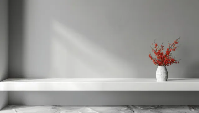 White shelf table with blank banner mockup and vase of red flowers on grey wall