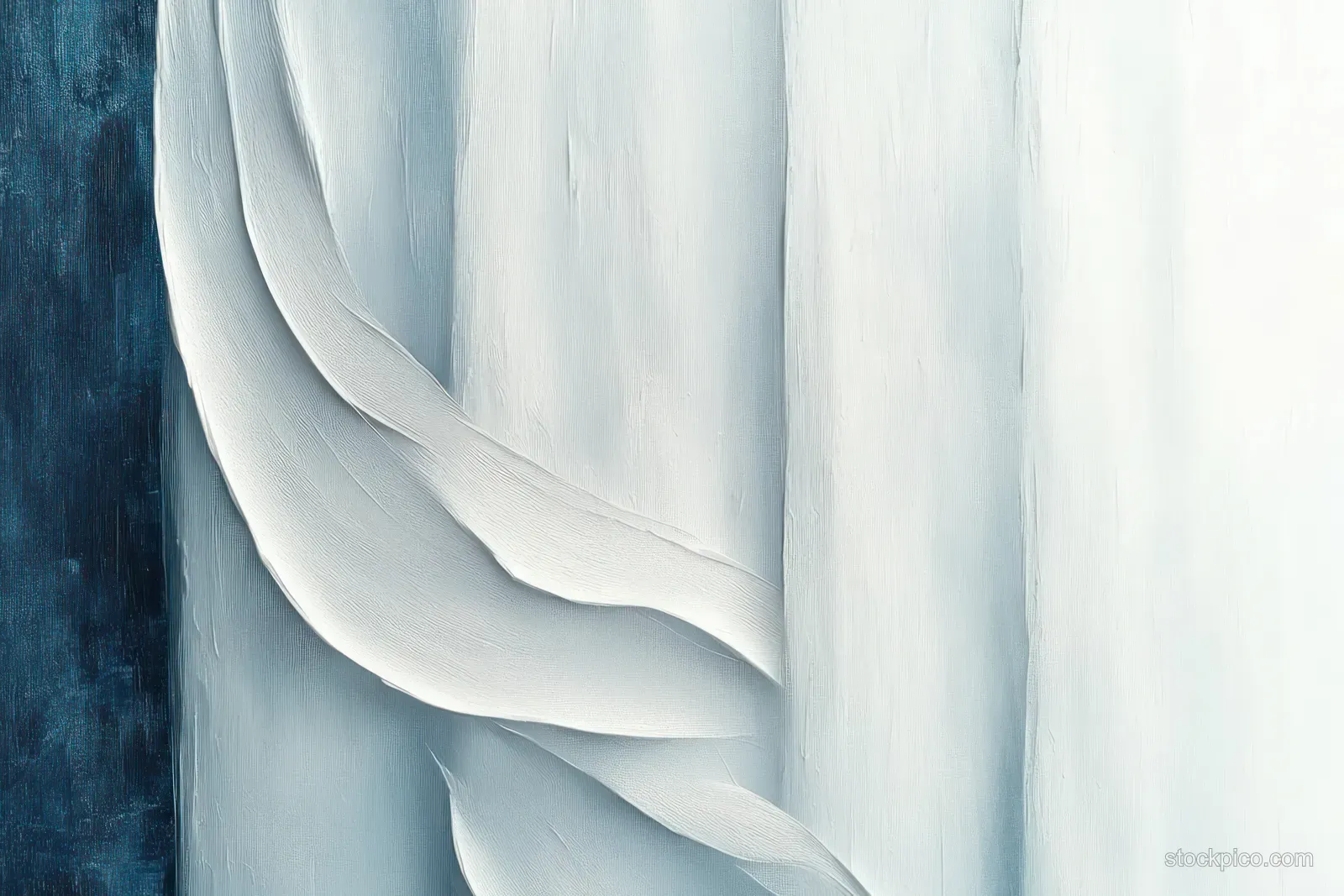Close-up of a white sculpted relief with flowing curved layers casting soft shadows on a light background.