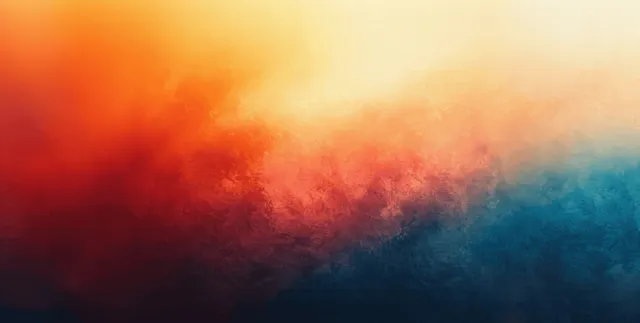 Orange and blue gradient abstract background with grainy blurred smoky texture and soft color blending.