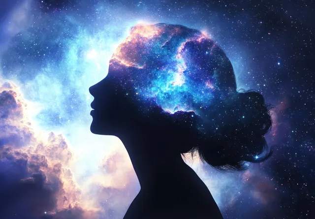 Side-profile silhouette of a woman meditating as a glowing chakra aura swirls across a dreamy galaxy backdrop.