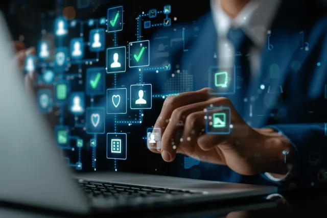HR manager reviews candidate documents on a laptop with glowing digital profile icons floating in the background.