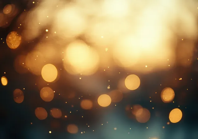 Golden bokeh circles and soft light streaks shimmer on a blurred vintage background.