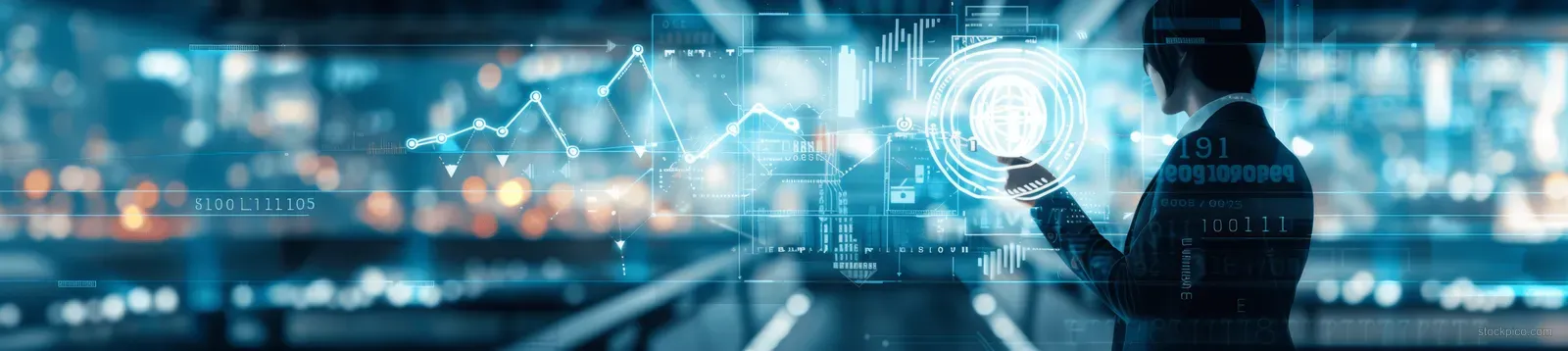 A businessman points to glowing charts on a virtual screen showing financial targets in a futuristic office.