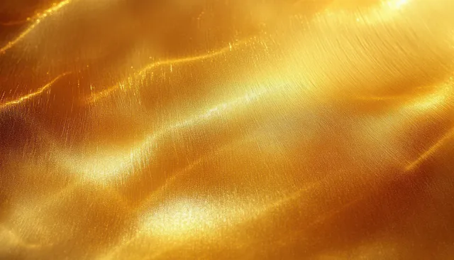 Golden metallic gradient texture with smooth brushed highlights and light glow