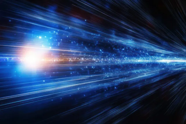 Blue and white light streaks burst across a dark space background with glowing particles.