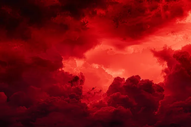 A red smoky sky with dark storm clouds and faint lightning glowing through the haze.