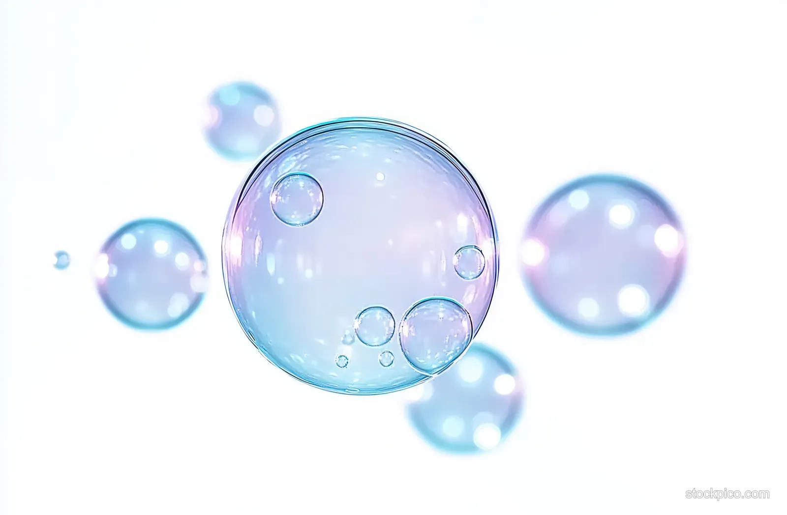 Translucent soap bubbles float in soft light with shimmering iridescent reflections and pastel color highlights.