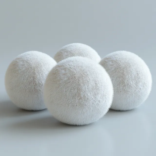Three isolated snowballs on white surface with soft shadow and frosty texture