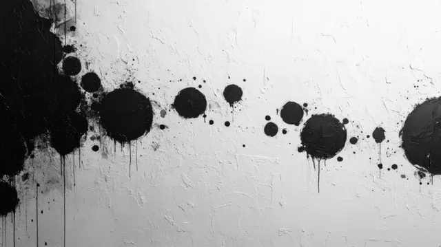 Monochrome abstract circles splashed across textured white paper with grunge splatter