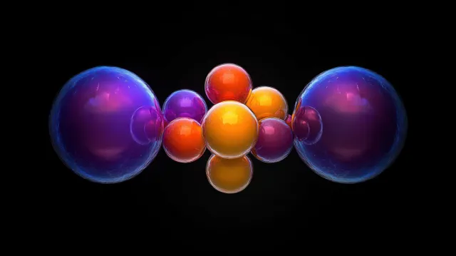 A symmetrical cluster of glossy purple, orange, and yellow spheres glows on a dark background.