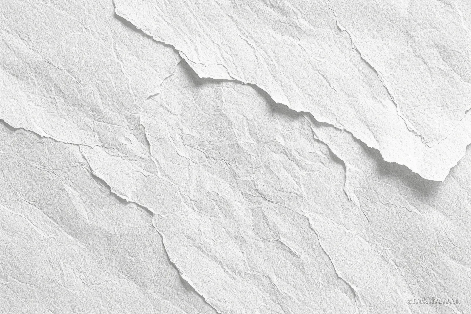 Top view of white watercolor paper with rough fibers, creases, and subtle uneven texture.