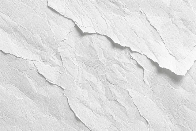 Top view of white watercolor paper with rough fibers, creases, and subtle uneven texture.