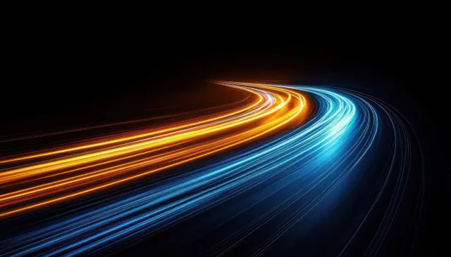 Car light trails curve through a night highway, blue and orange motion streaks
