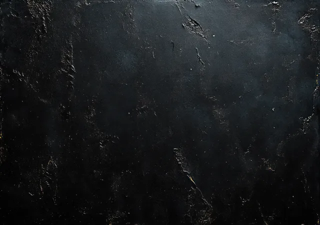 Close-up of a dark rough textured wall surface with small cracks and subtle highlight variations.
