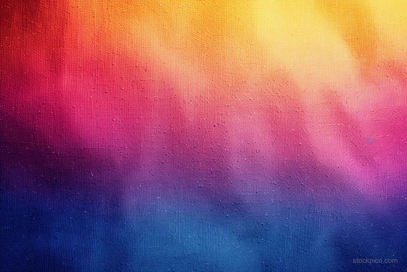 Abstract rainbow gradient on a grainy canvas texture with warm colors fading into deep blue.