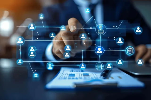 Businessman editing digital organization chart with HR workflow nodes in office setting