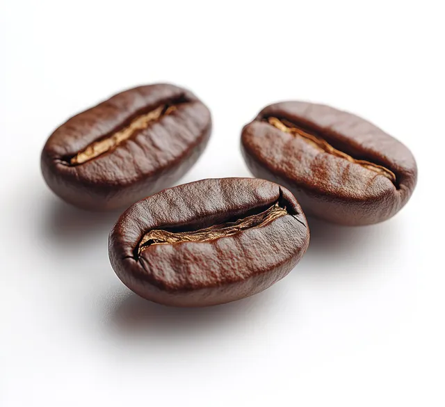 Three roasted coffee beans shown in macro detail with brown texture and cracks on a white background.