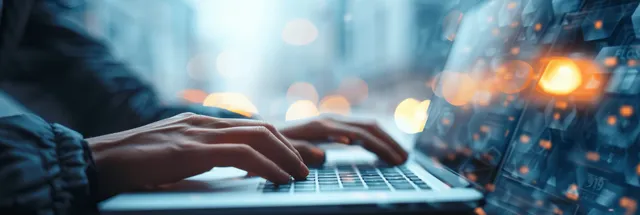 Woman typing on laptop keyboard at desk, office lighting bokeh, copy space with Shallow Depth Of Field