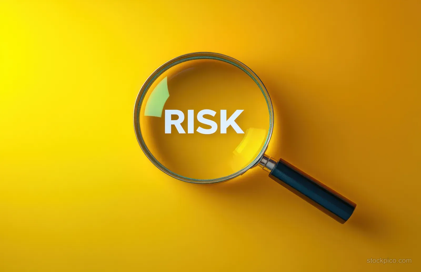 A magnifying glass highlights the word RISK against a bright yellow background.
