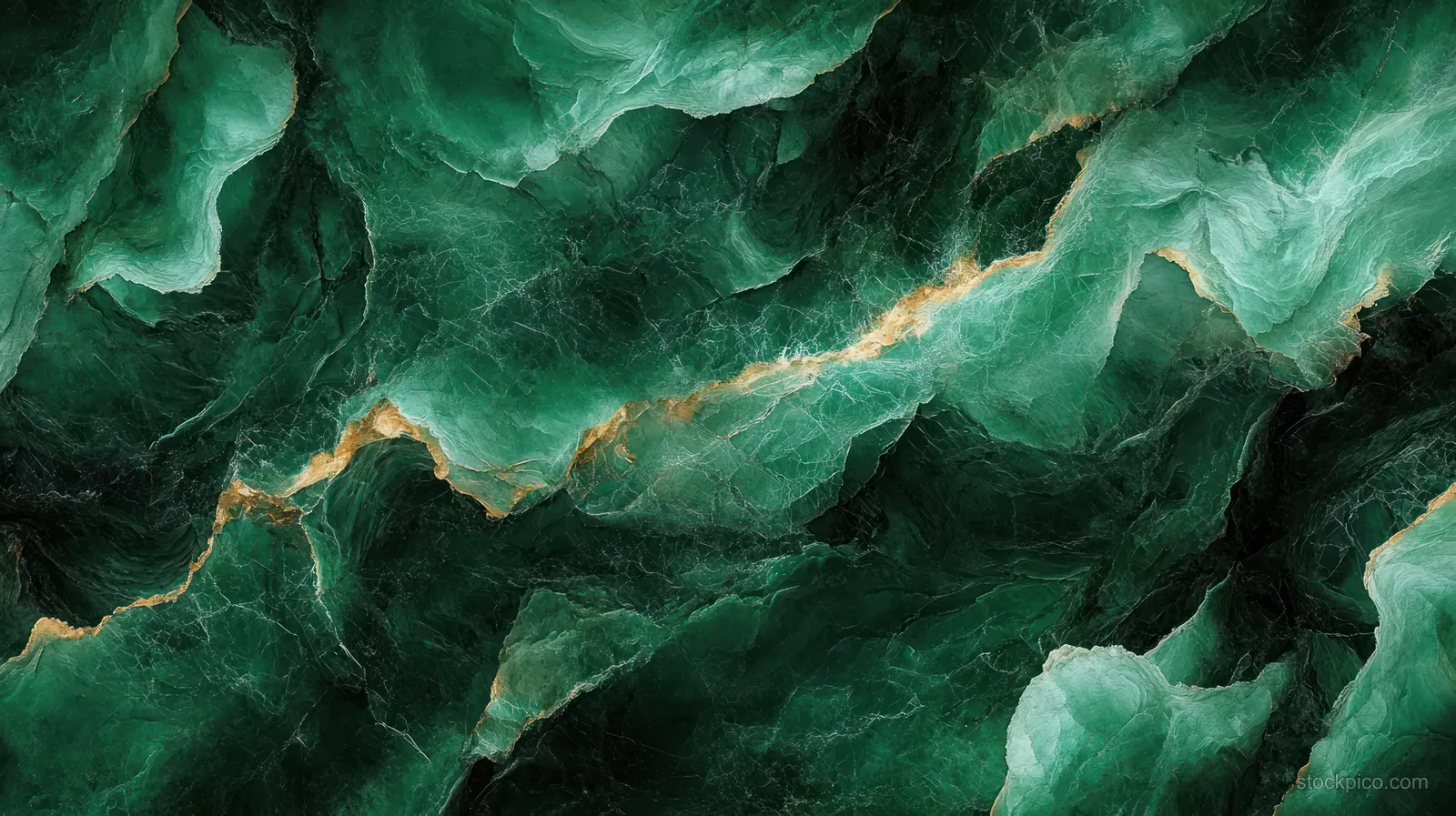 Close-up emerald marble surface with branching gold veins and layered green mineral textures.