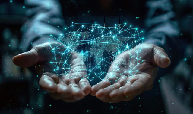Two hands holding a glowing hologram world map with connected network nodes and lines