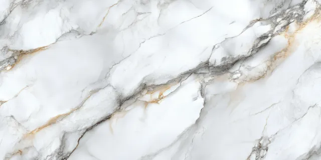 White marble surface with fine grey and gold veins.