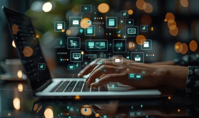 Hands using laptop with floating document icons, database links, and cloud storage concept