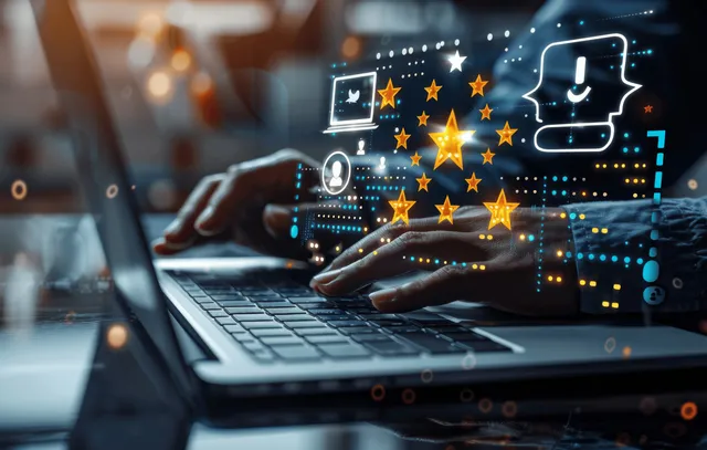 A hand works at a laptop showing glowing star ratings and feedback icons for customer evaluation.