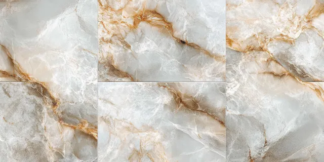 Close-up of marble tiles with white and gray stone layers and golden-brown veining texture.