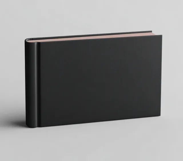 Minimalist black book mockup on neutral surface with soft shadow and natural light