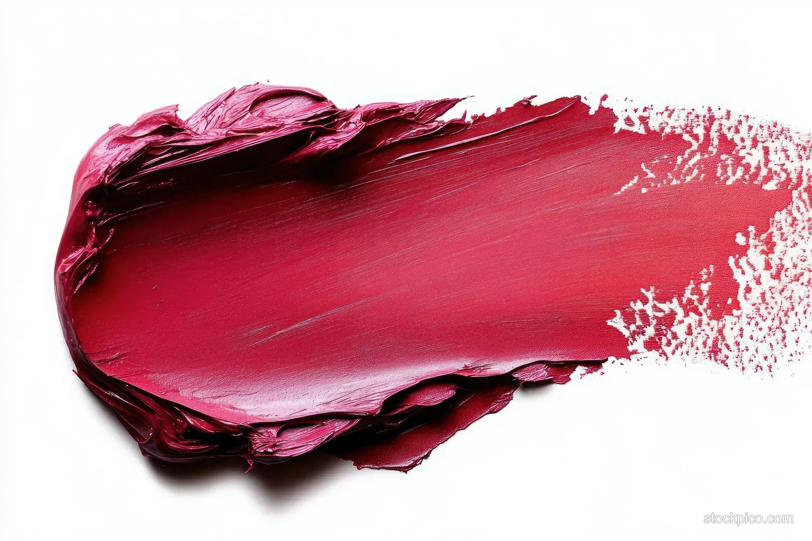 Thick deep red lipstick smear with glossy creamy texture spread across a white background.