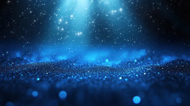 Blue particles sparkle across a dark cosmic scene while bright light beams and bokeh glow in the haze.