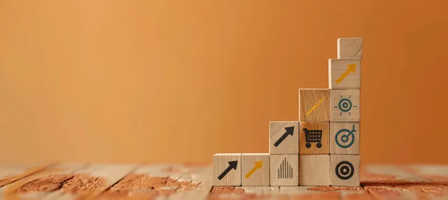 Wooden blocks stacked in steps with growth icons on an orange background.