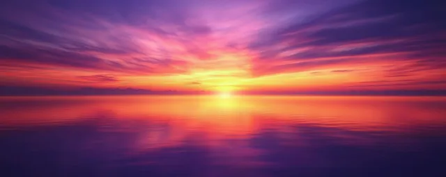 A vibrant sunset paints the sky in purple, orange, and yellow above a calm ocean reflecting the dramatic clouds.